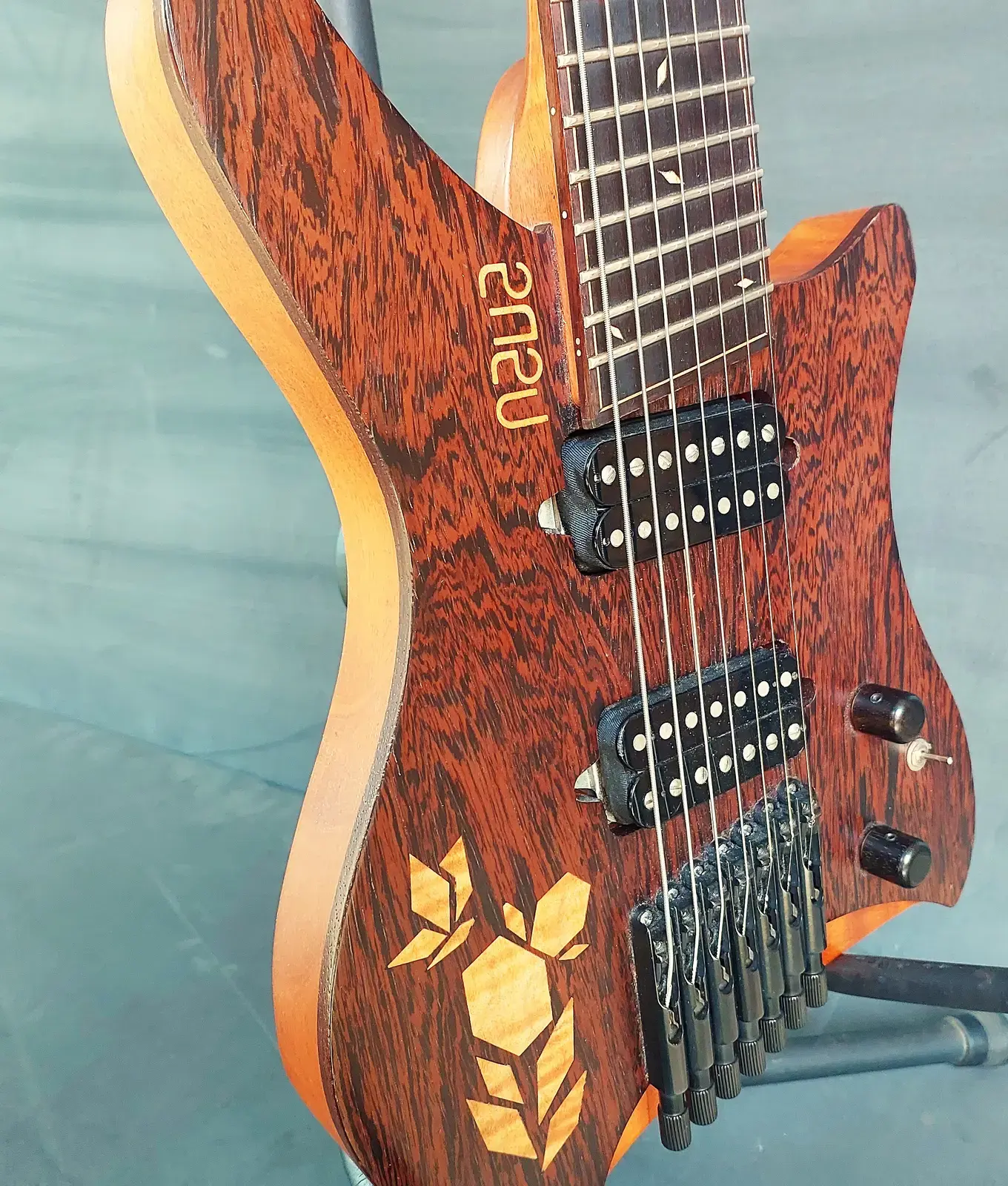 Nava Evell body with leaf inlay and logo