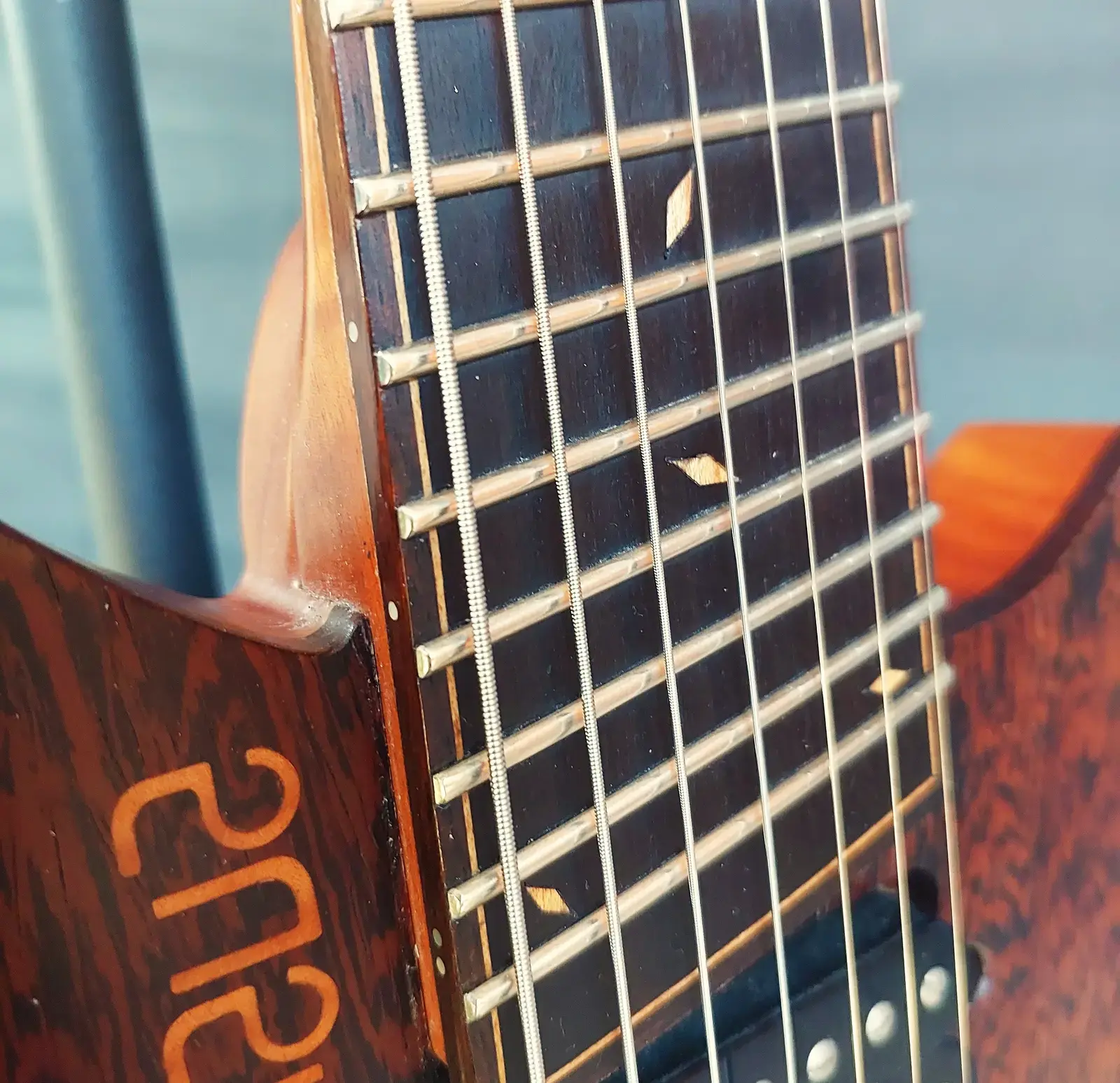 Nava Evell fretboard and logo
