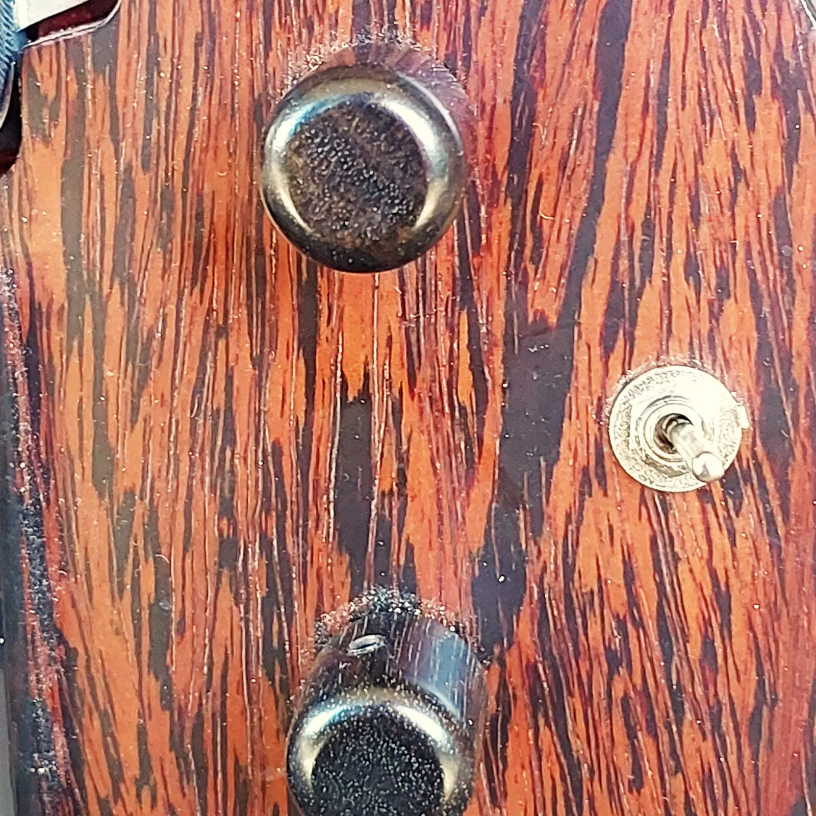 Nava Evell control knobs and figured grain