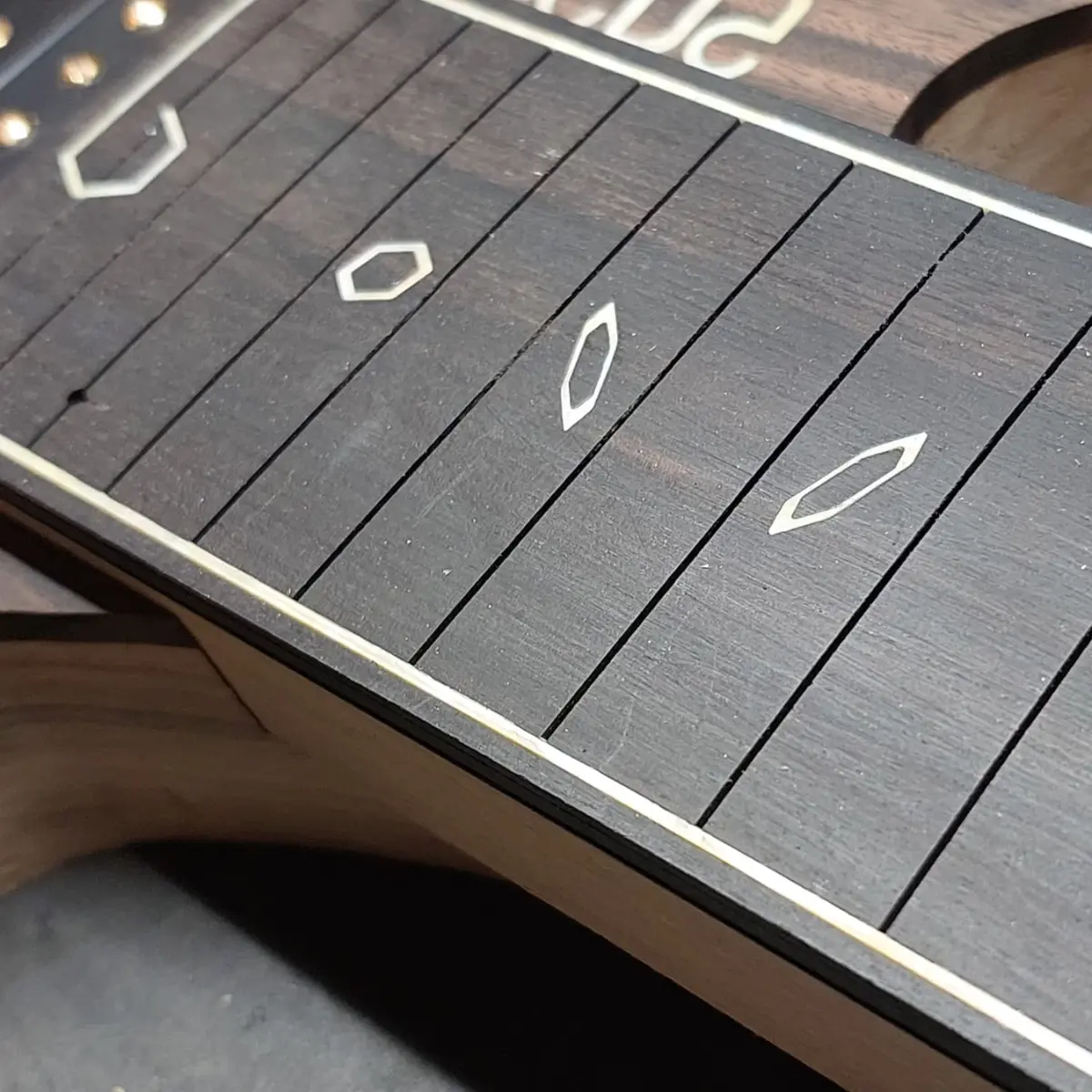 Nava Guitars fretboard tooling detail